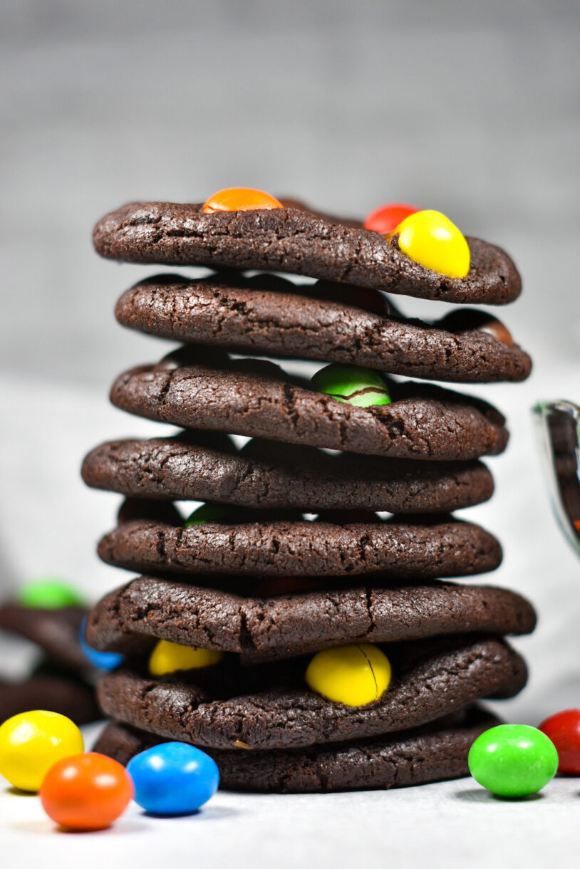 Caramel M&M Cookies in a tall stack