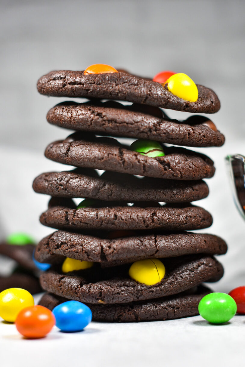 Caramel M&M Cookies in a tall stack