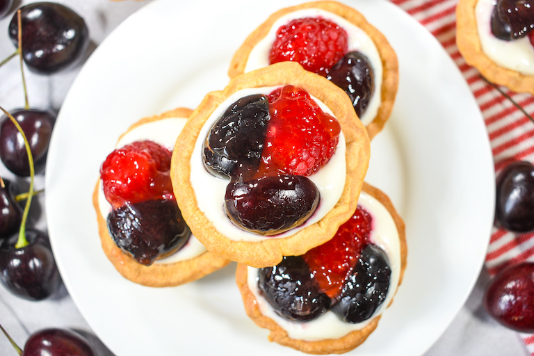 A plate of mini tarts, made from a berry tart recipe