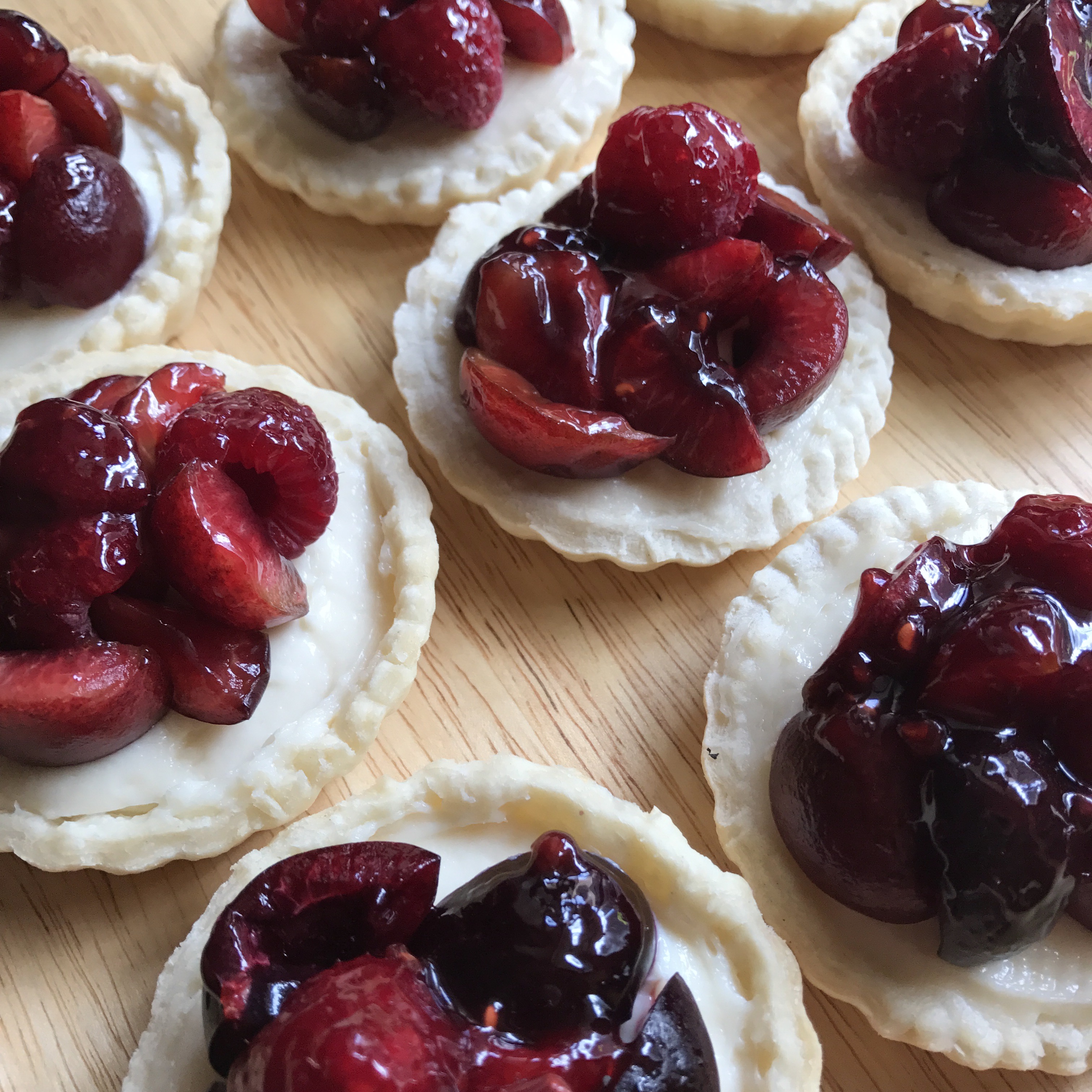 Miniature tarts with raspberries and cherries