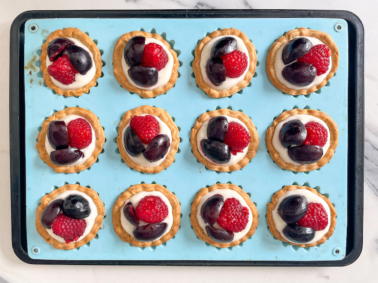 Miniature fruit tarts in a silicone pan