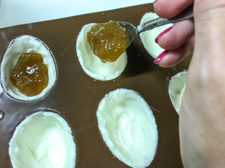 Spooning jam into egg mold