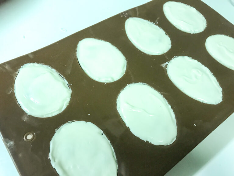White chocolate eggs in silicone mold