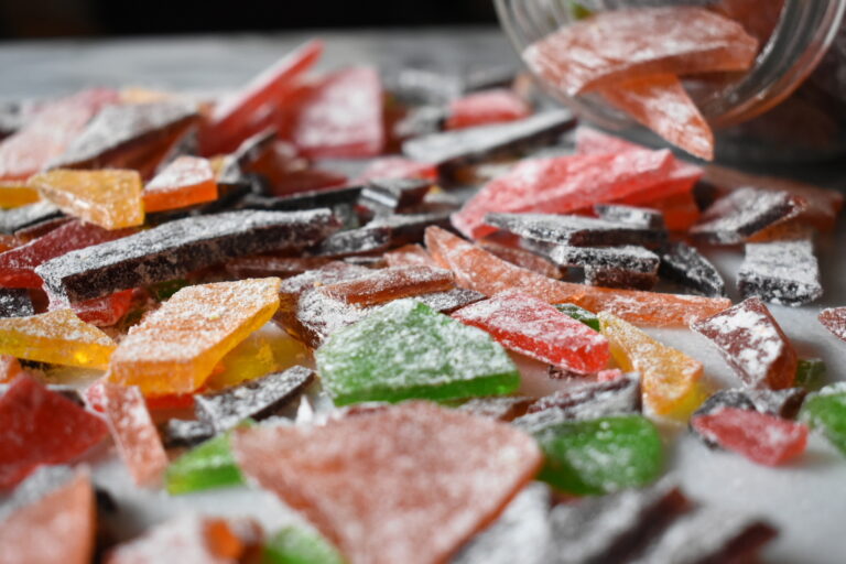 Colorful hard candy coated in powdered sugar, made from an old-fashioned homemade hard candy recipe