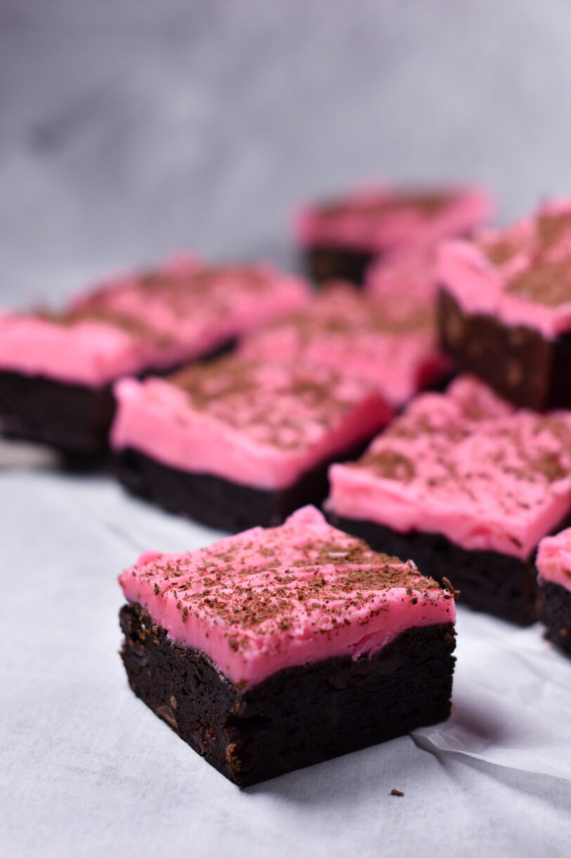 Chocolate cherry brownies on white surface