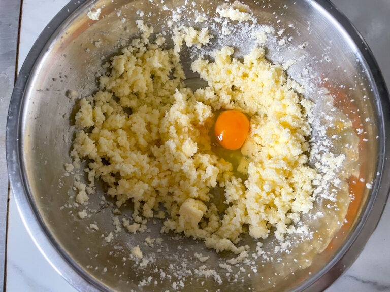 Egg in butter bowl