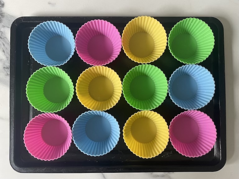 A tray of silicone cupcake liners