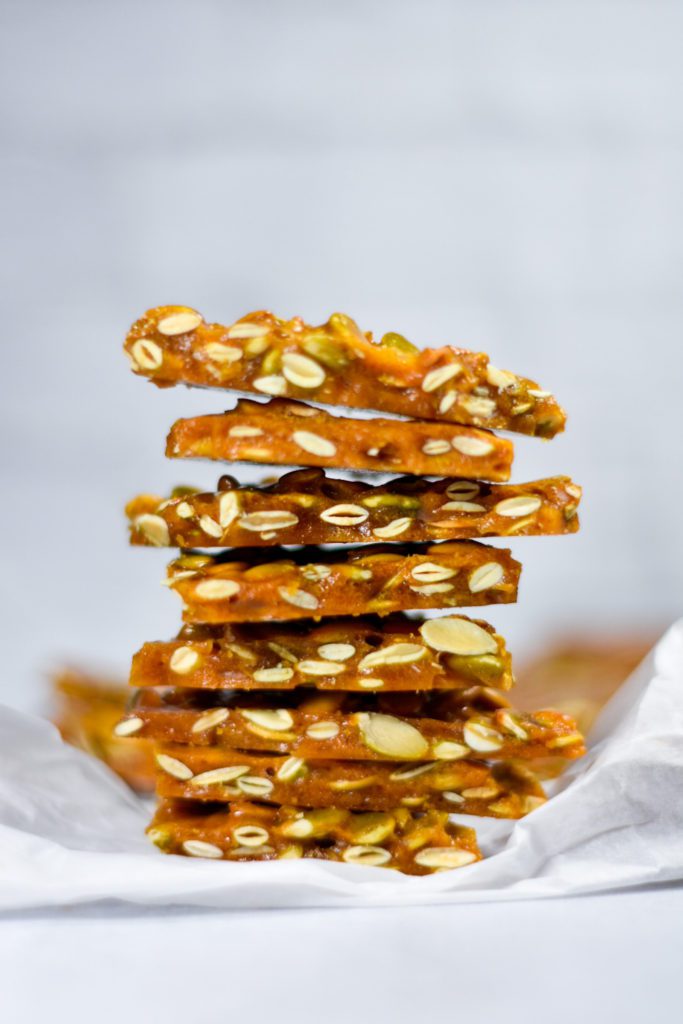 A stack of spiced pumpkin seed brittle candy