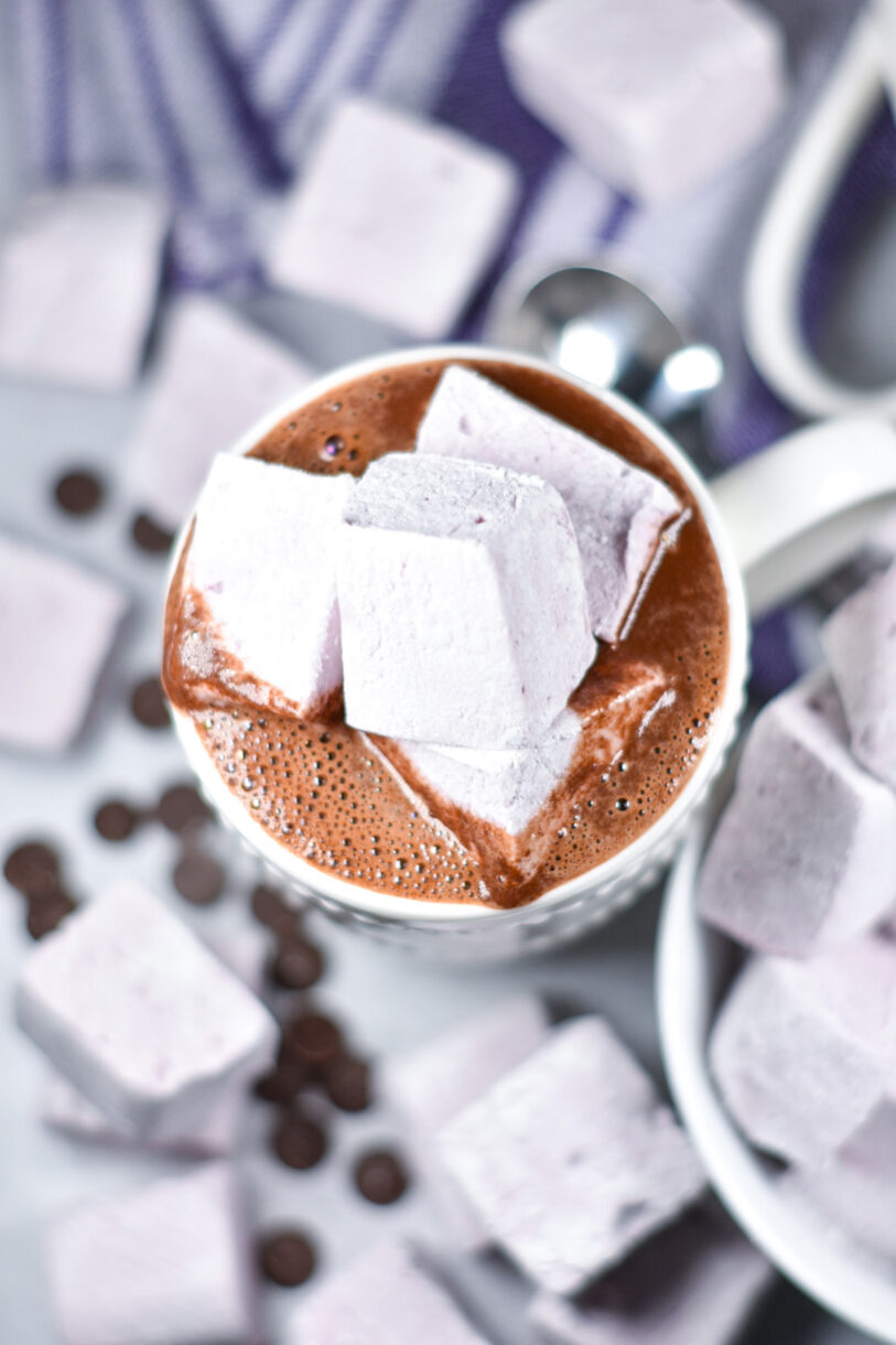 Looking down into a mug of boozy hot chocolate topped with homemade marshmallows