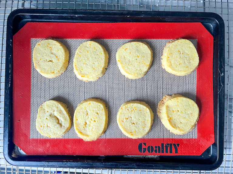 A tray of orange shortbread cookies