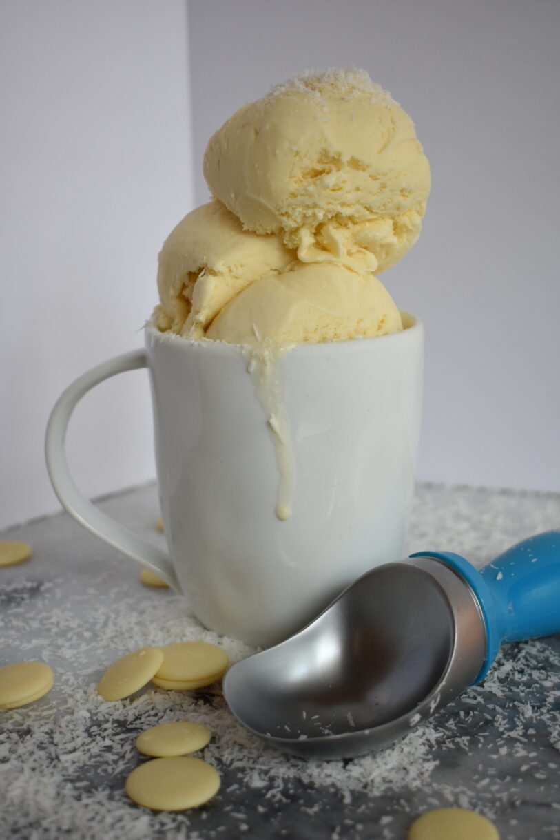 Scoops of white chocolate coconut in a mug