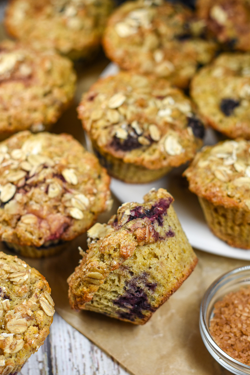 Mixed berry muffins on a sheet of parchment