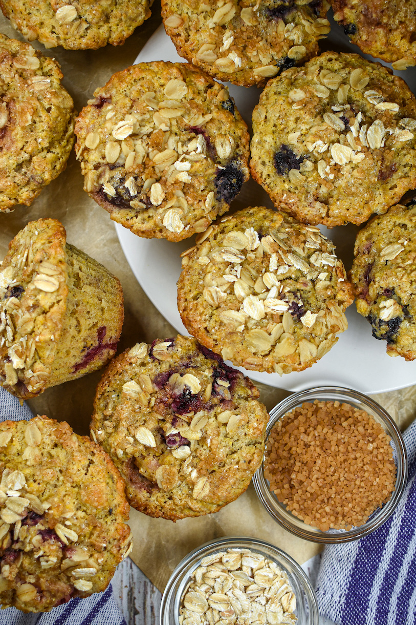 mixed berry muffins arranged on a white plate