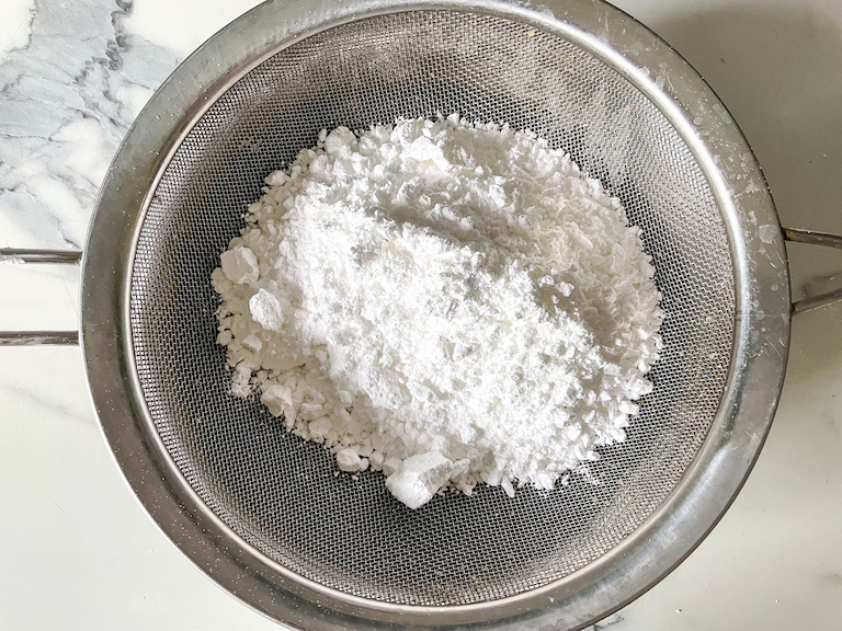 Mesh sieve with confectioner's sugar