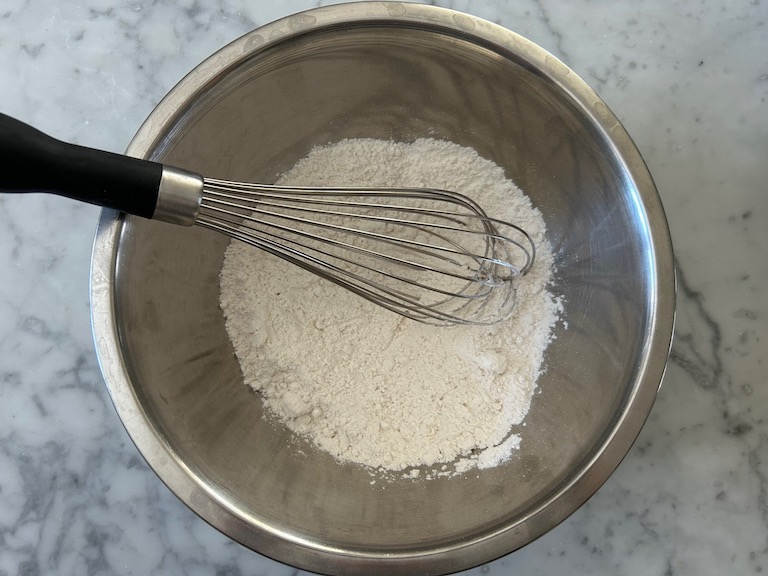 dry ingredients in a bowl with a whisk