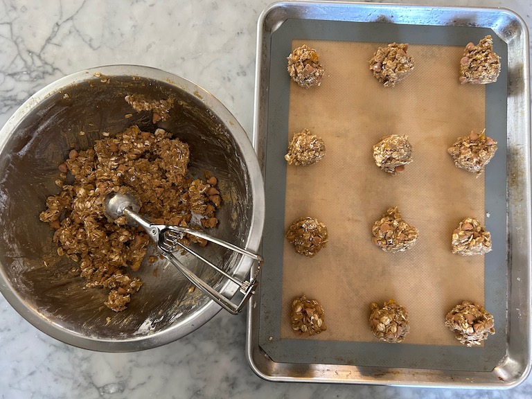 Dish of cookie dough and a tray of scoops of cookie dough