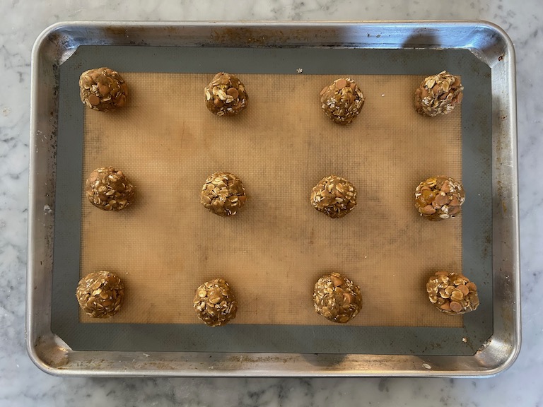 Balls of cookie dough on a tray