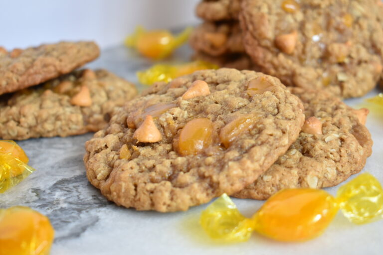 Triple Butterscotch Oatmeal Cookies and butterscotch candies on marble surface