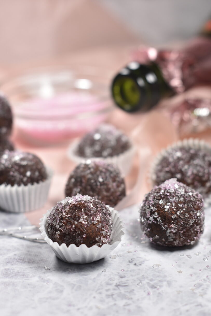 Champagne Truffles in white cups, with a bowl of pink sugar