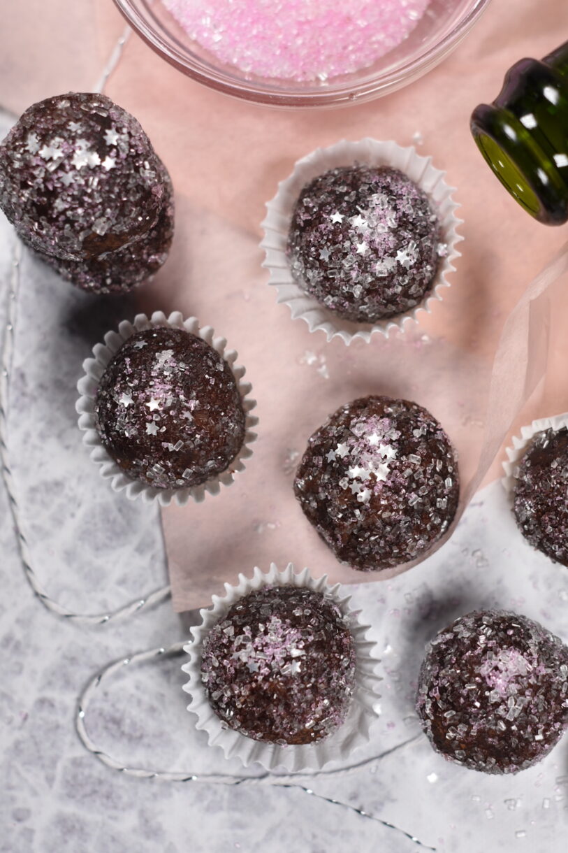 Sparkling Rosé Truffles on a white surface