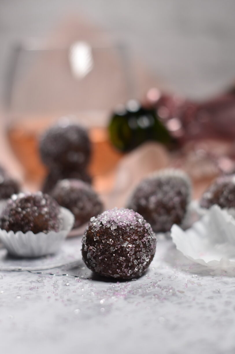 Sparkling wine truffles on a light grey background