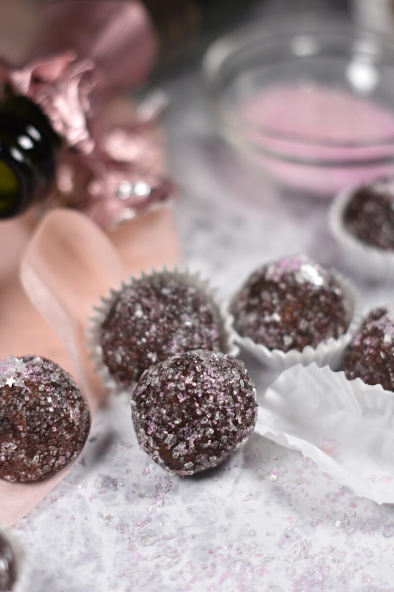 Sparkling Rosé Truffles on a white surface
