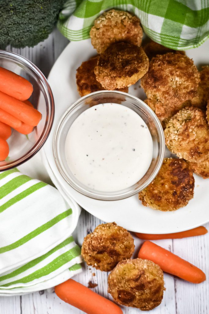 Baked Veggie Nuggets and a dish of ranch dressing on a plate with carrots