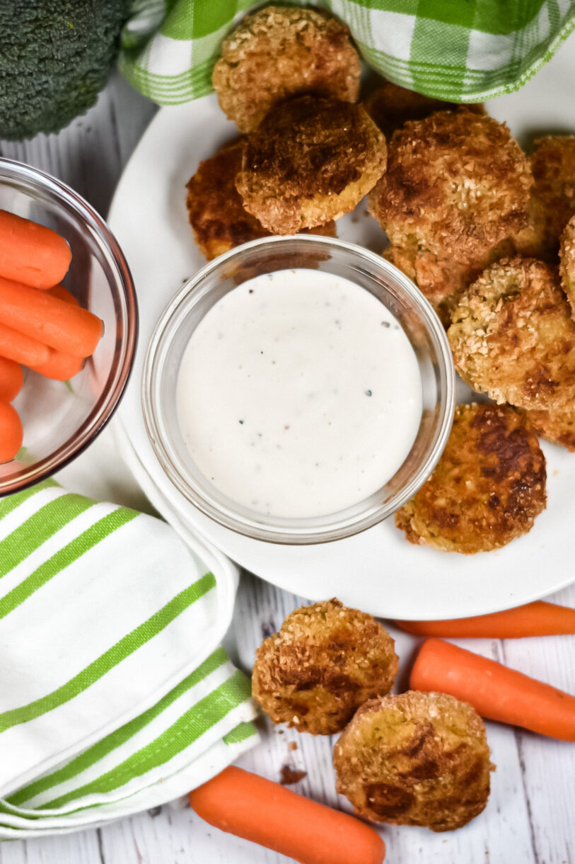 Baked veggie nuggets and a bowl of ranch dressing