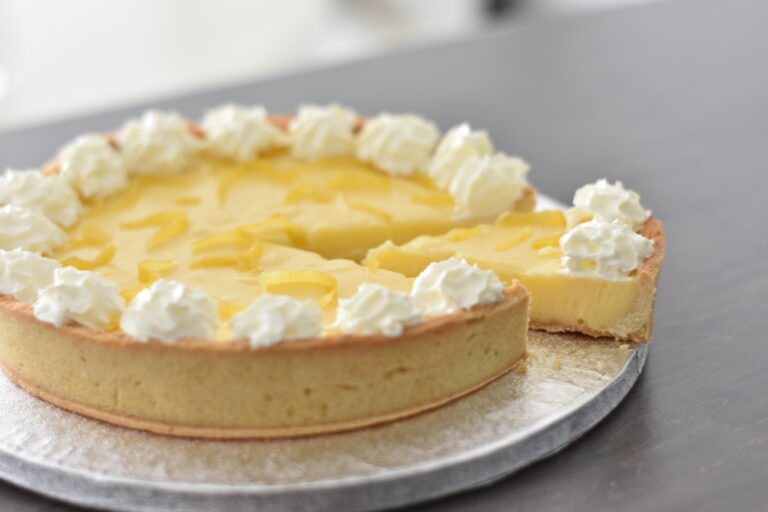Lemon tart with a slice cut out