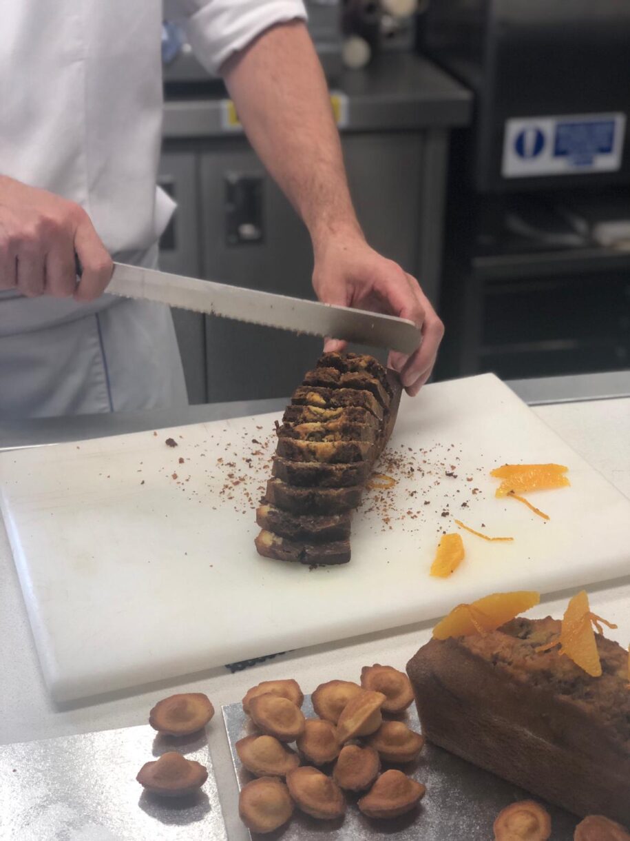 Le Cordon Bleu chef slicing the marble cake