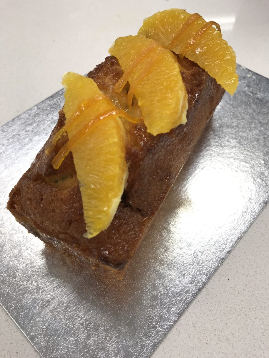 Orange chocolate marble cake on silver board