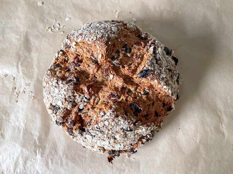Loaf of soda bread on a sheet of parchment