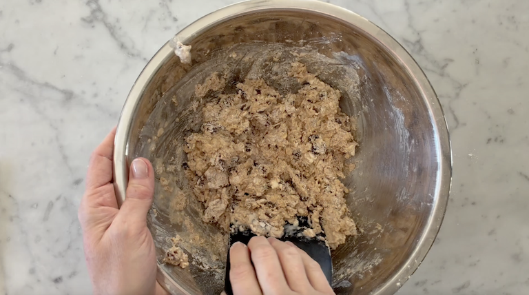 Mixing soda bread dough in a metal bowl