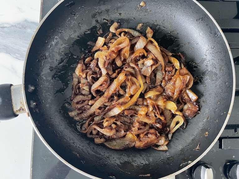 A pan of caramelised onions on the stovetop