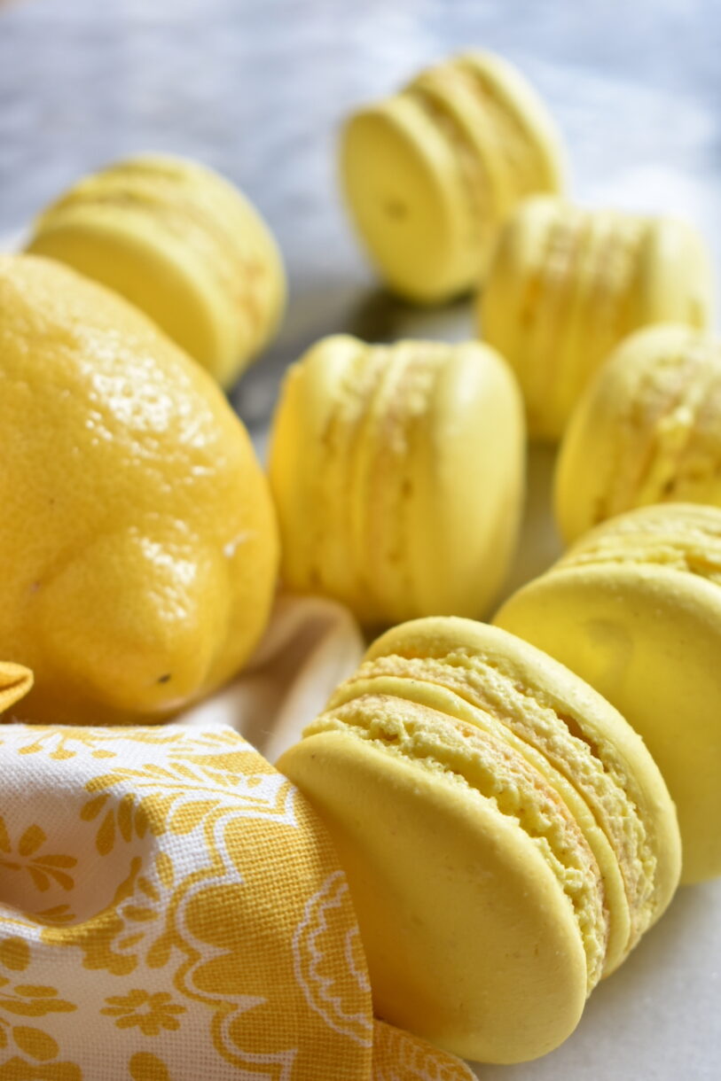 Lemon macarons with a yellow tea towel