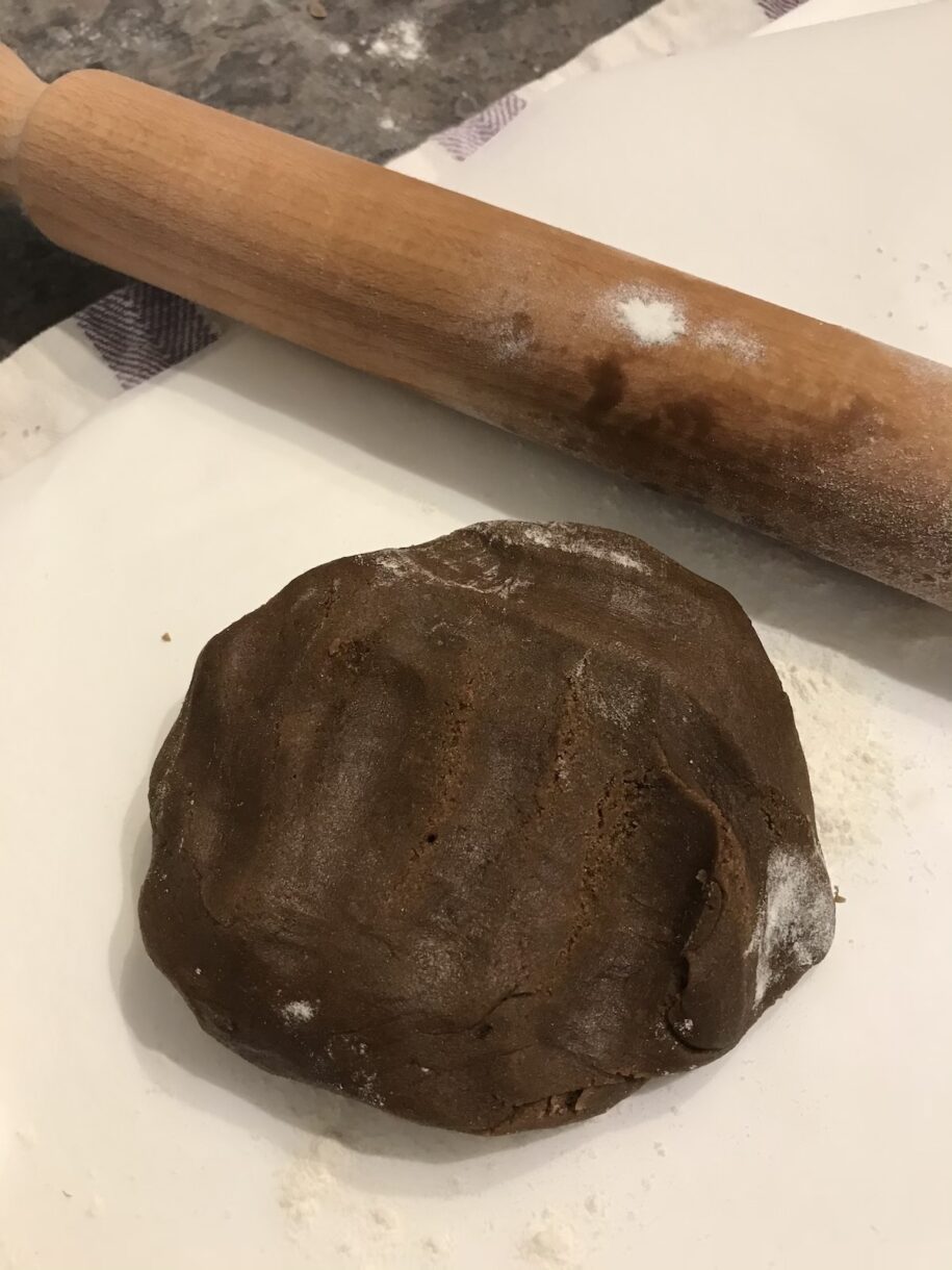 Rolling pin and a ball of gingerbread dough