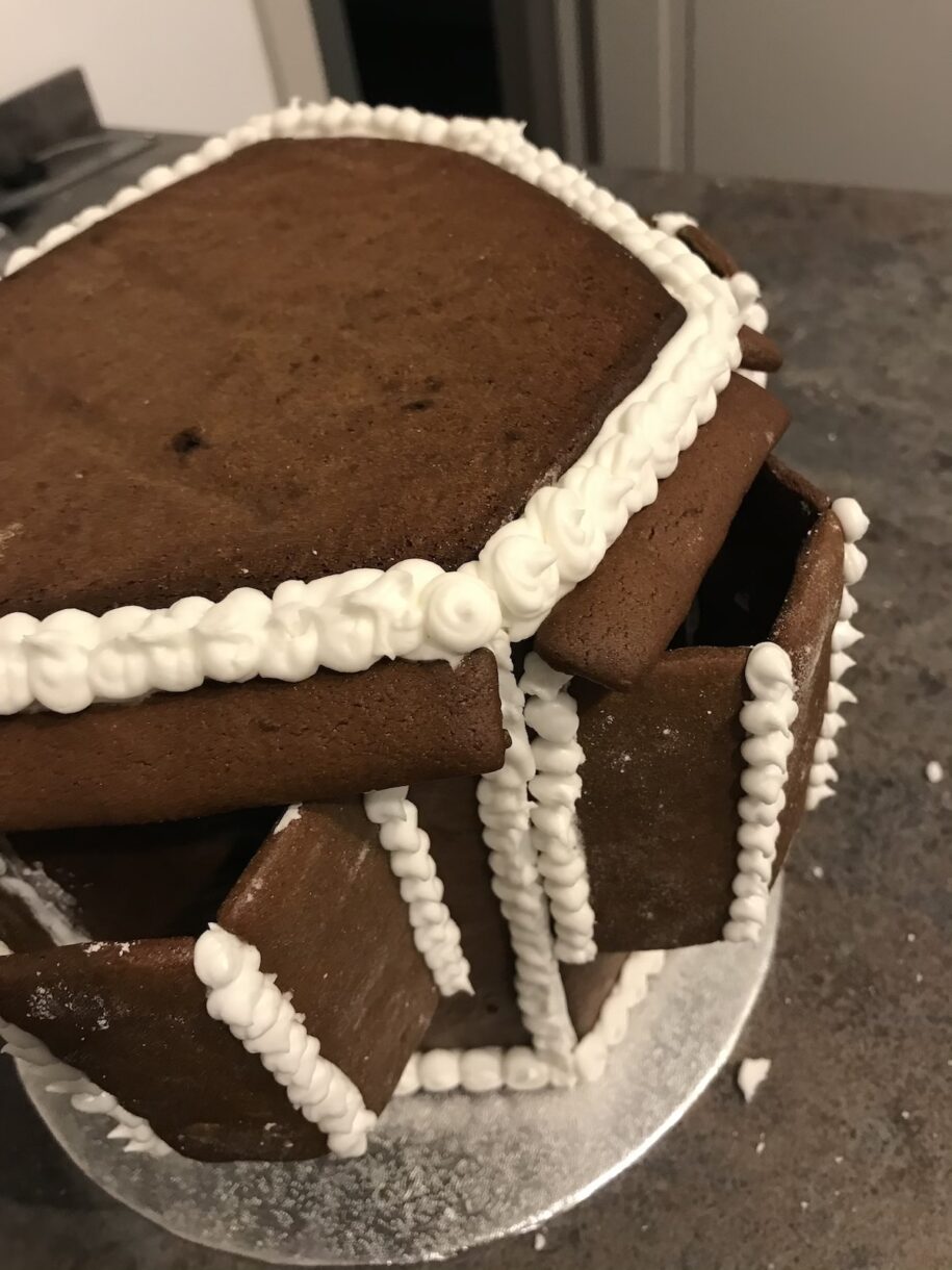 Gingerbread house construction on a countertop