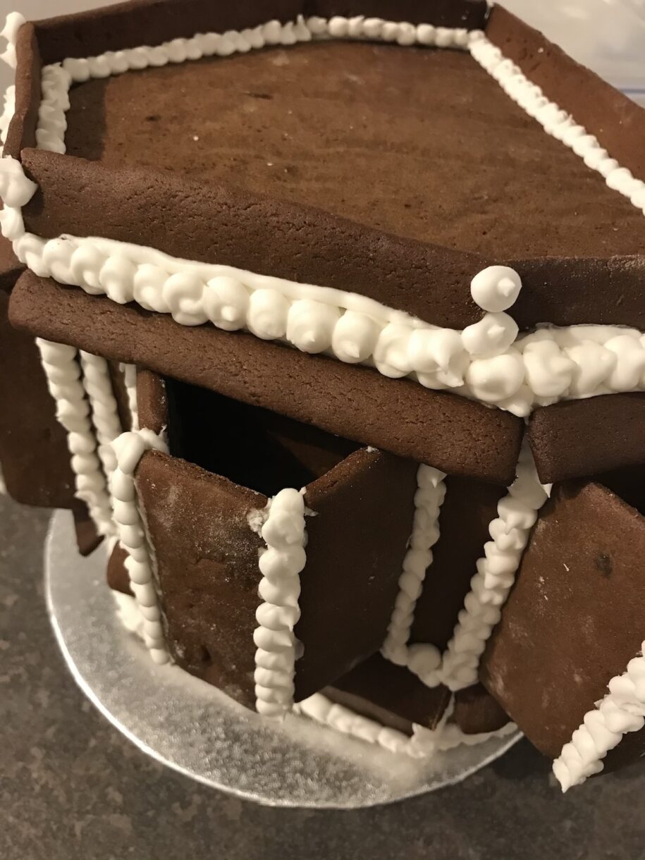 Gingerbread house pieces and royal icing piping