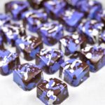 Chocolate bon bons with purple decoration