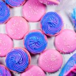 Bright pink and purple buttecream filled macarons