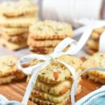 Apricot shortbread biscuits in a stack with a raffia ribbon