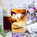 Lavender iced coffee on a white background, with food photography and styling by Rebecca Frey
