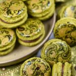 Green macarons painted to look like paisley fabric