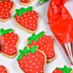 Strawberry cookies and a tube of royal icing