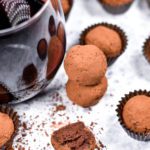 Red wine truffles, cocoa powder, and glass of wine