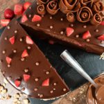 Strawberry chocolate cake with knife