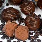 Dark chocolate espresso truffles surrounded by espresso beans
