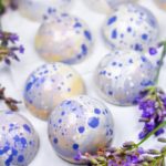 Lavender bon bons on a white surface