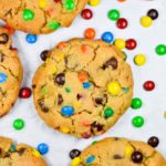 Peanut butter M&M cookies on white background