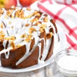 A white plate with bundt style applesauce cake food photography